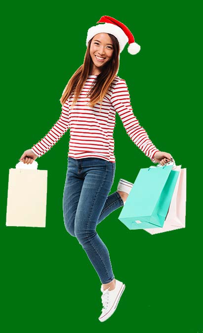 A woman holding a phone and shopping bags